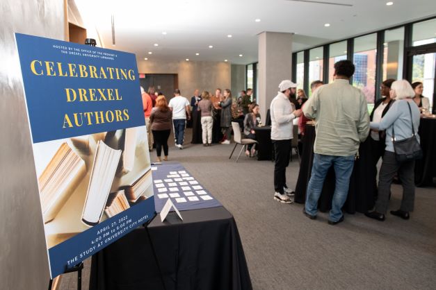 people enjoy refreshments during the Celebrating Drexel Authors event